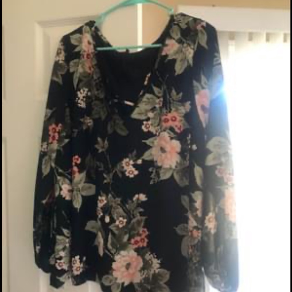 Women’s dress blouse with criss cross detail